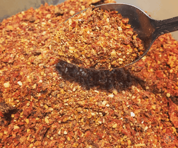 Dried seasoning on a spoon.