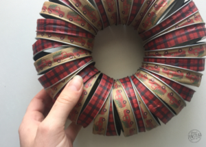 Lay wreath flat and straighten the rings so they overlap