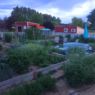 1 acre homestead layout: garden with red barn in background