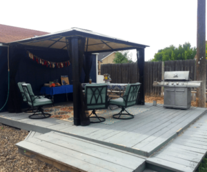 Stay cool without air conditioning: covered porch with chairs and bbq grill