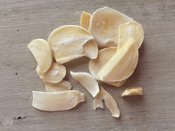 Homemade Garlic Powder: slices of dried garlic lying on table