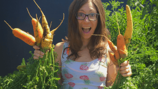 Behind the Scenes August 2019: Woman holding carrots