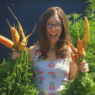 Behind the Scenes August 2019: Woman holding carrots