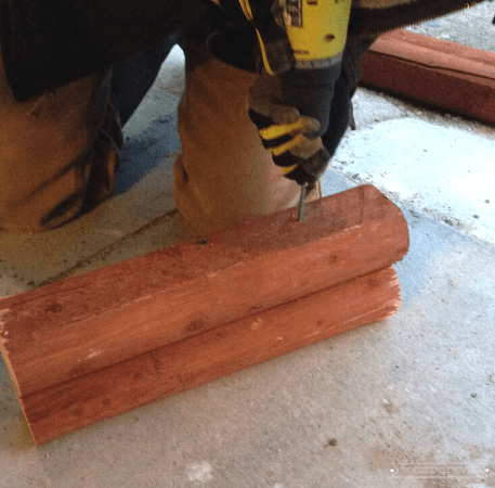 Drilling into two pieces of wood.