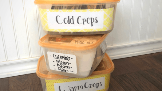 3 stacked and labeled seed storage bins