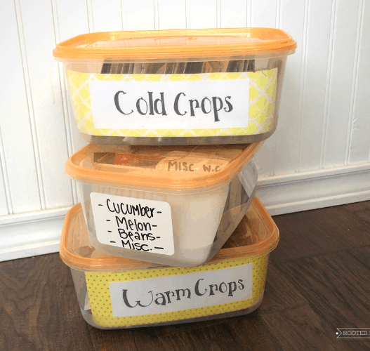 3 stacked and labeled seed storage bins