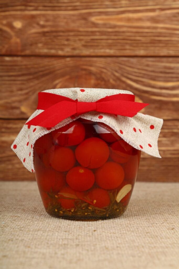 A jar of cherry tomatoes with their skins on